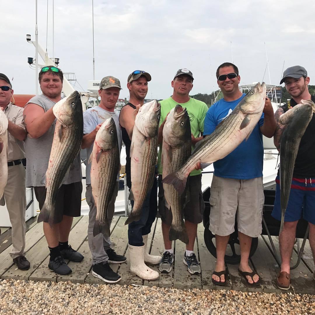 A group of guests with their catch after a guided charter