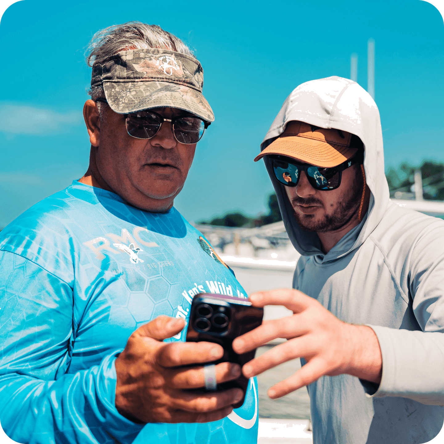 A guest holding a striped bass caught on a trip booked through the Partner Network